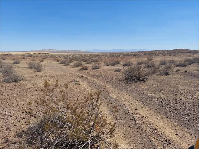 a view of beach and mountains