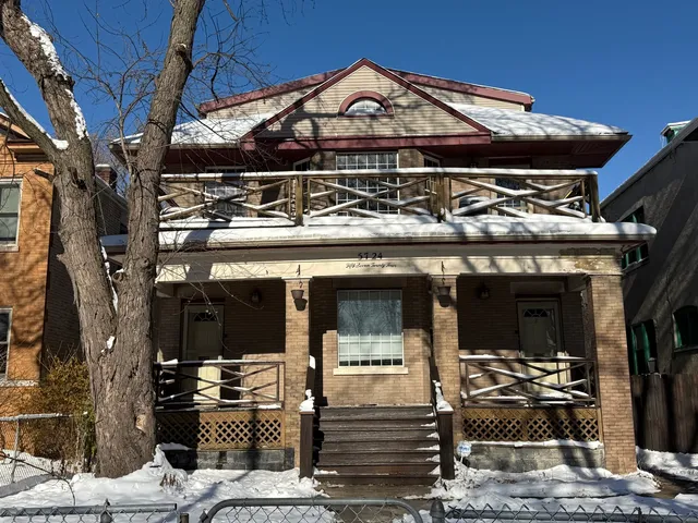 a front view of a building with parking space