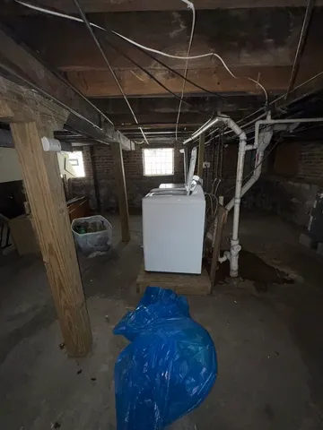 a front view of a house with table and chairs