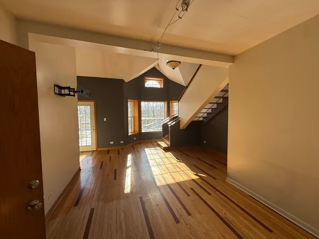 a kitchen with refrigerator and window