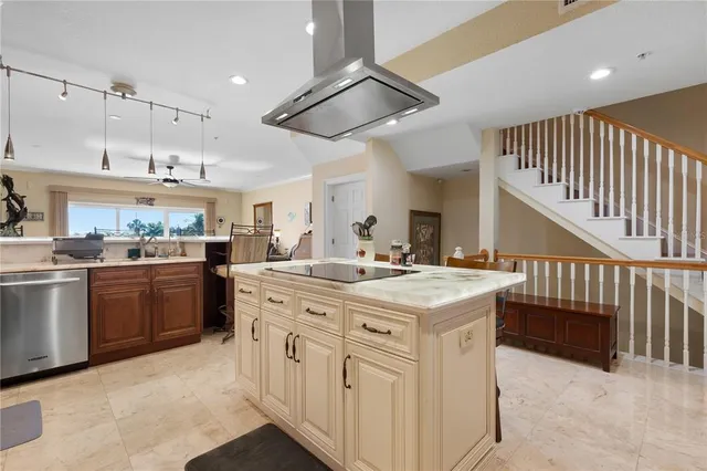 a view of a livingroom with workspace and a window