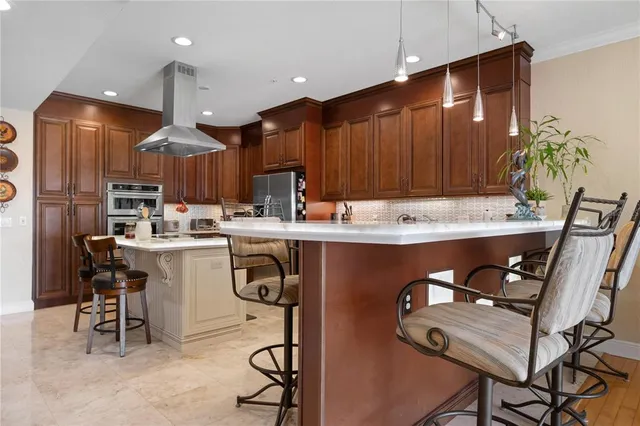 a living room with furniture a flat screen tv and a wall painting