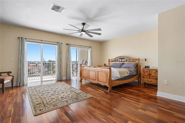 a bathroom with a sink a large mirror and a bathtub