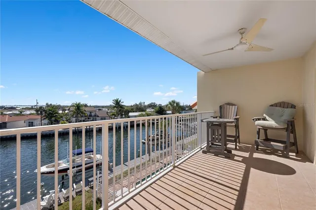 a bedroom with a large bed and flat tv screen on dresser
