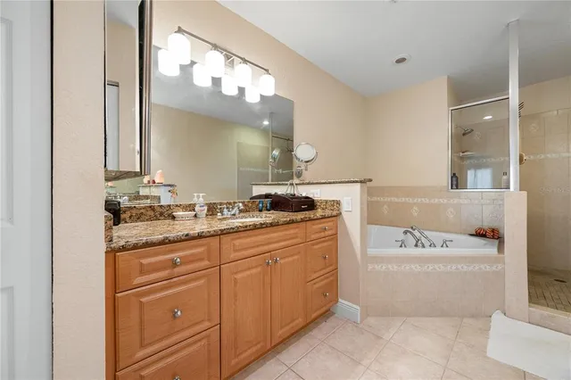 an aerial view of a house with a swimming pool and outdoor space