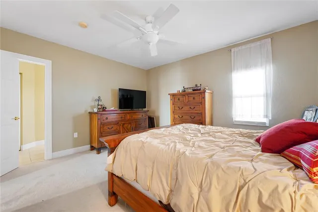 an aerial view of a house with garden space and ocean view