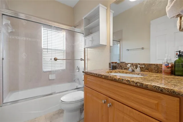 an aerial view of a house with a lake view