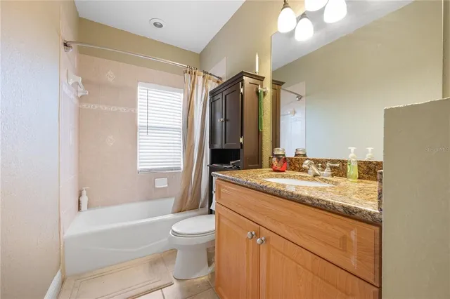 an aerial view of a house with a lake view