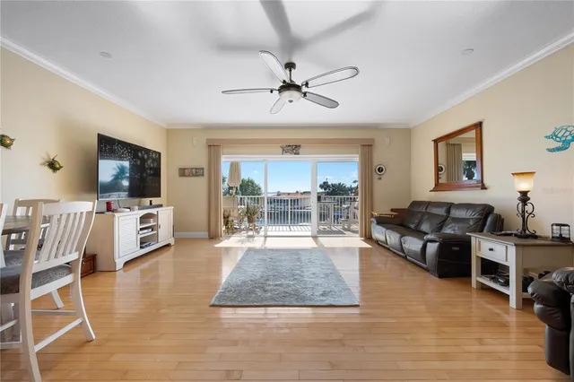 a view of a lake with boats and palm trees
