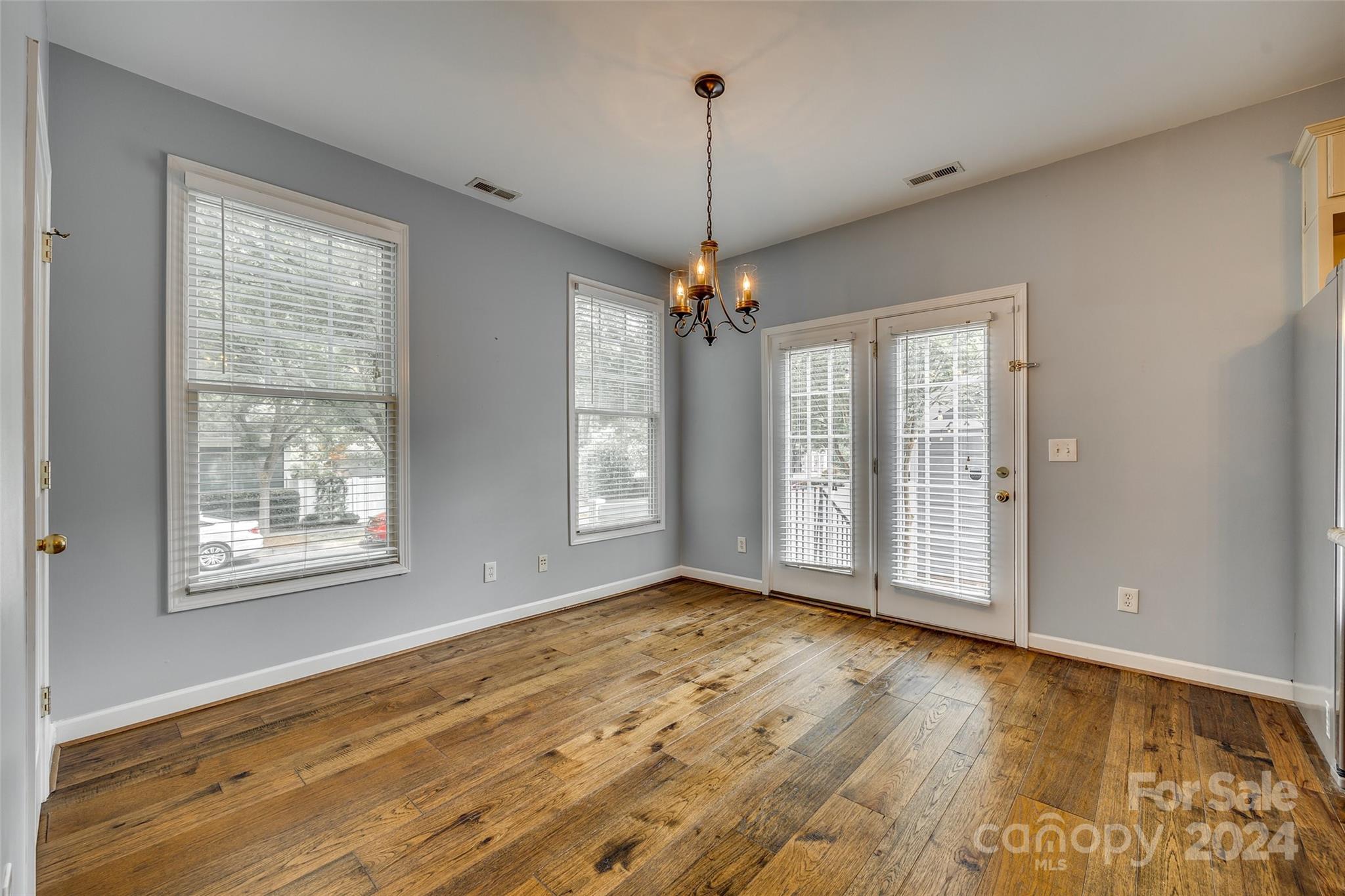 1107 Market Street Fort Mill, SC 29708 - Photo 11 of 30 a view of an empty room with window and hardwood floor