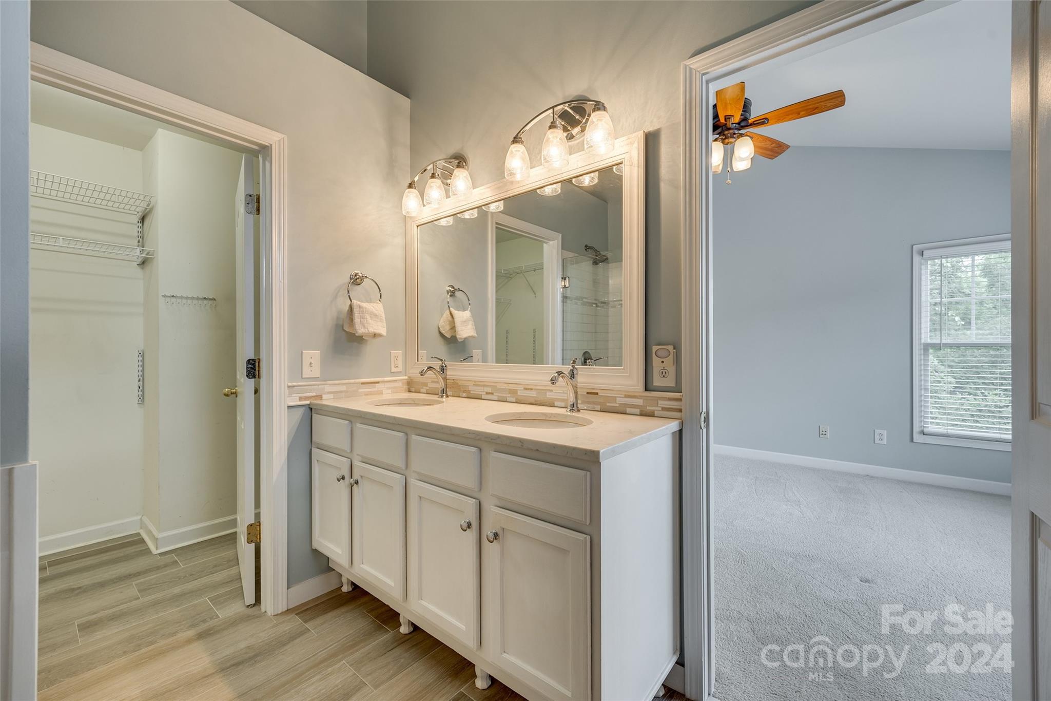 1107 Market Street Fort Mill, SC 29708 - Photo 17 of 30 a bathroom with a double vanity sink and a mirror