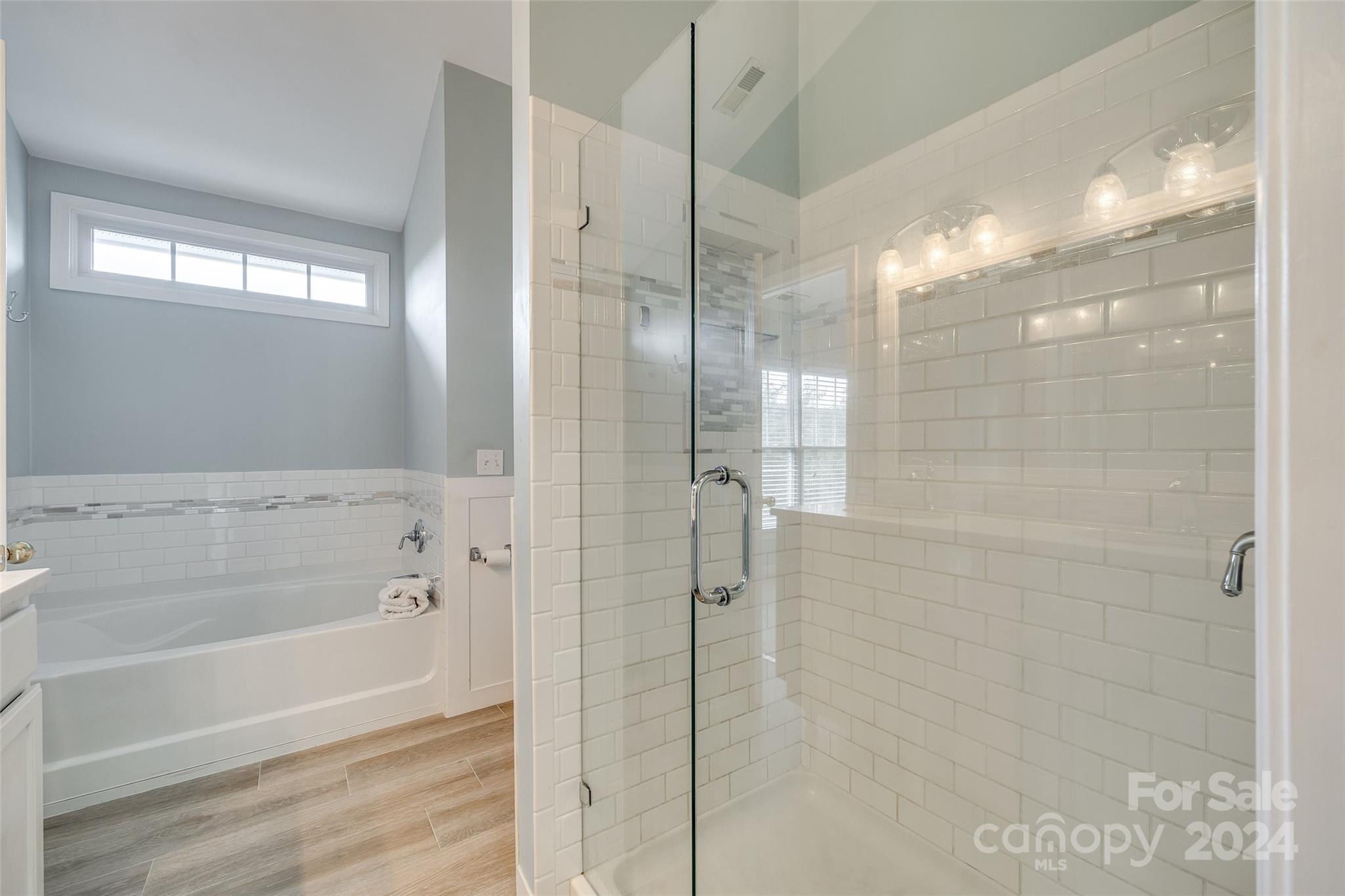 1107 Market Street Fort Mill, SC 29708 - Photo 18 of 30 a bathroom with a shower and a bath tub