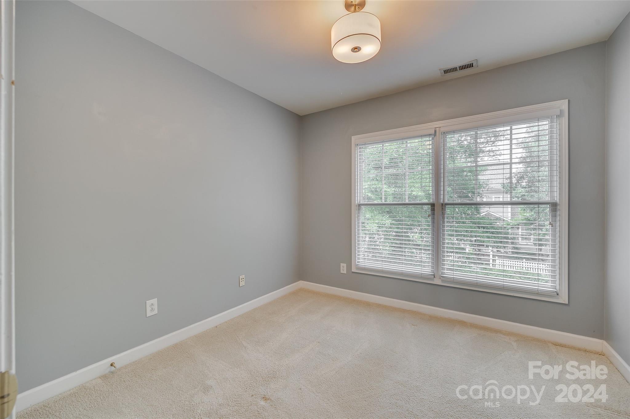 1107 Market Street Fort Mill, SC 29708 - Photo 22 of 30 an empty room with a window
