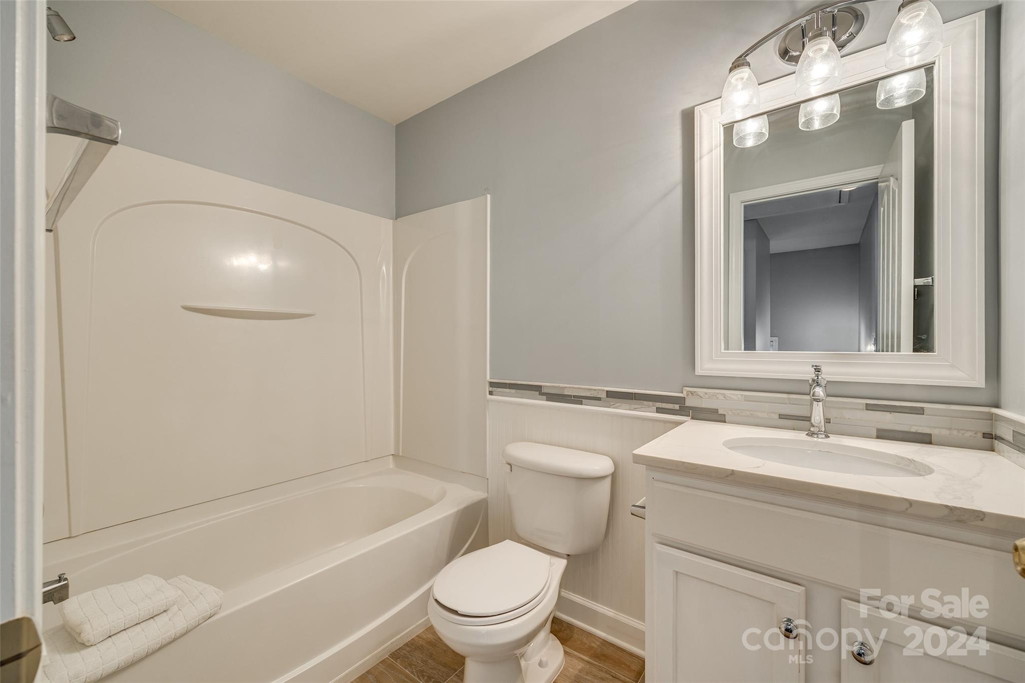 1107 Market Street Fort Mill, SC 29708 - Photo 26 of 30 a bathroom with a sink a toilet and a bathtub