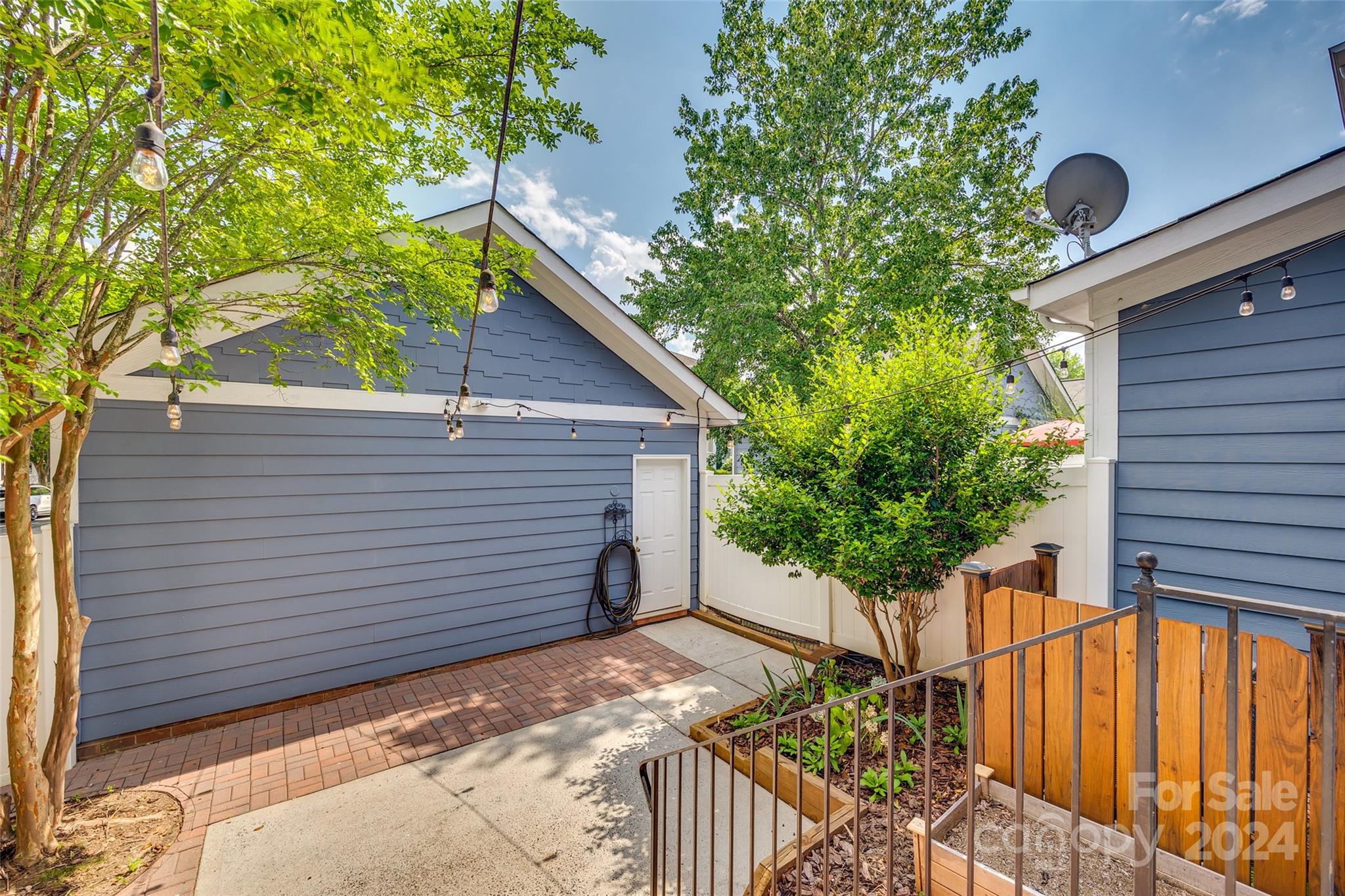 1107 Market Street Fort Mill, SC 29708 - Photo 27 of 30 a view of a house with a yard and potted plants