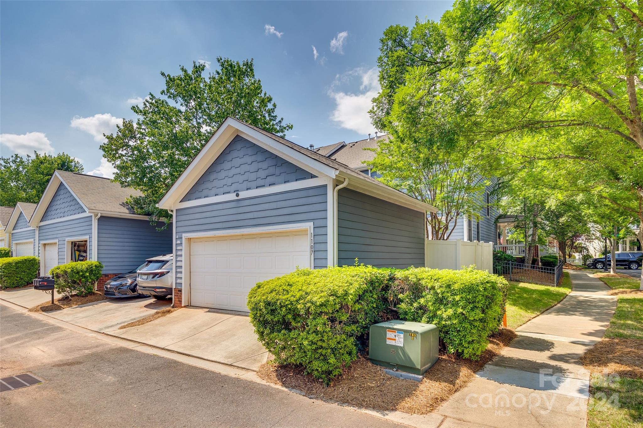 1107 Market Street Fort Mill, SC 29708 - Photo 29 of 30 a front view of a house with a yard and potted plants