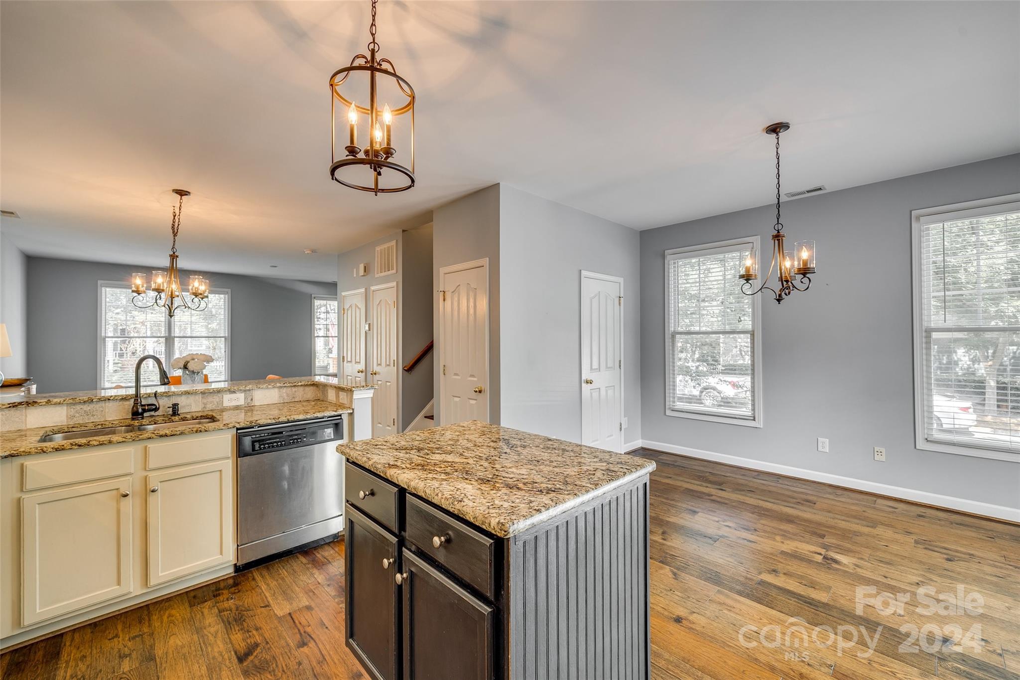 1107 Market Street Fort Mill, SC 29708 - Photo 6 of 30 a kitchen with granite countertop stove top oven and cabinets