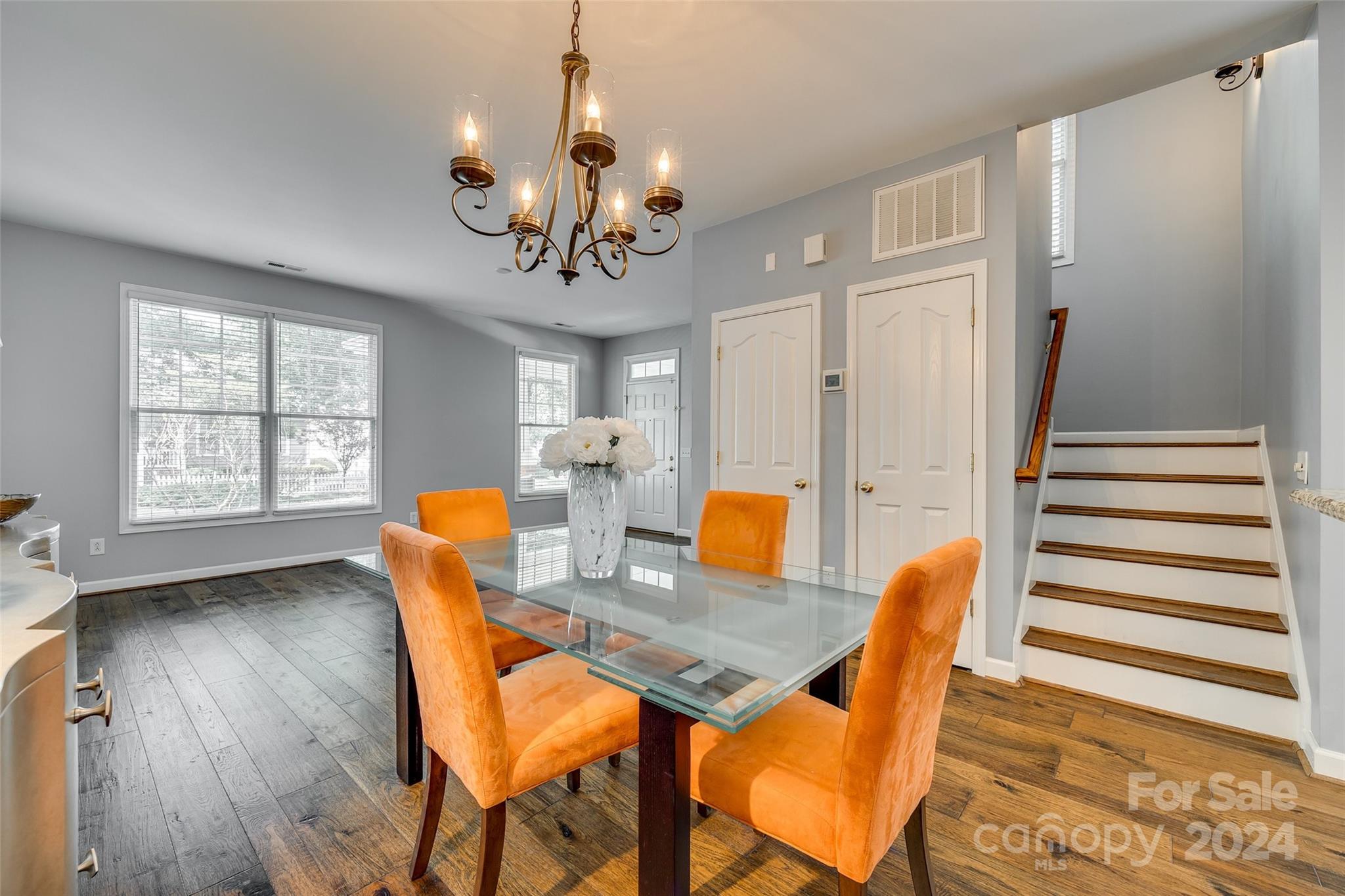 1107 Market Street Fort Mill, SC 29708 - Photo 9 of 30 a view of a dining room with furniture wooden floor and chandelier