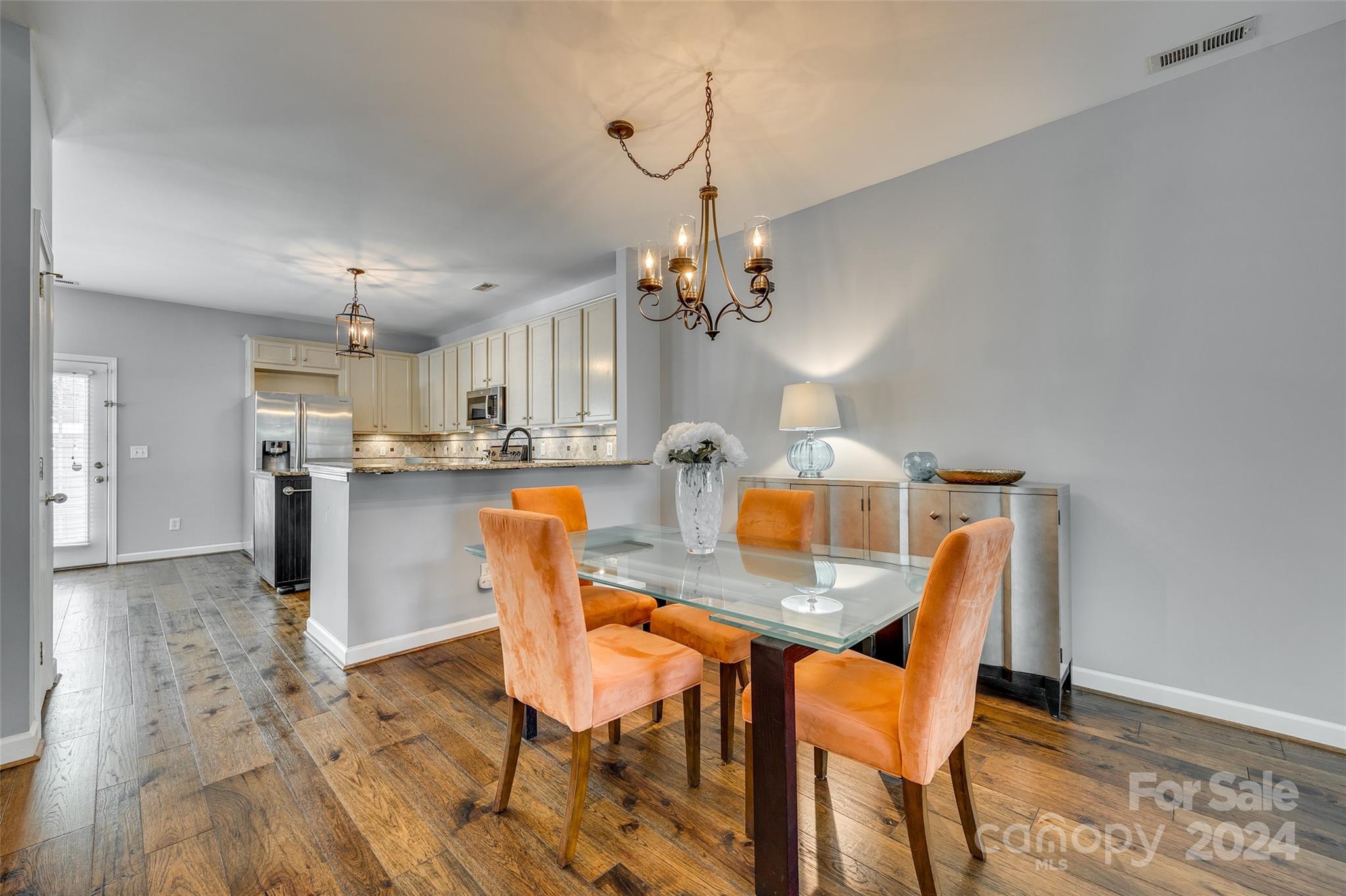 1107 Market Street Fort Mill, SC 29708 - Photo 10 of 30 a view of a dining room with furniture and wooden floor