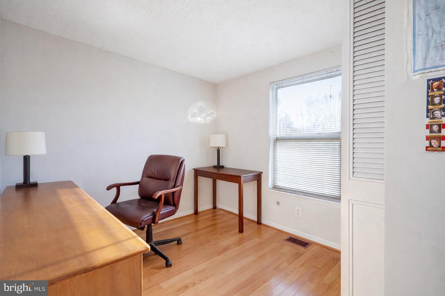 7467 Lone Star Road Lorton, VA 22079 - Photo 13 of 21 a workspace with furniture and a window