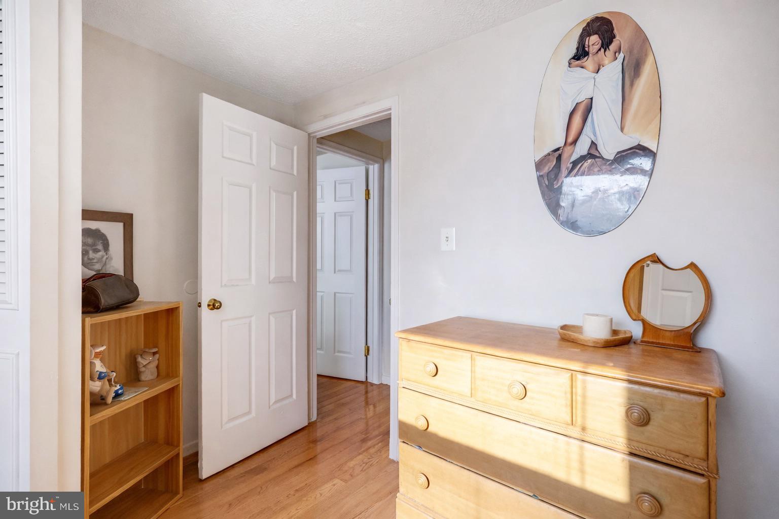 7467 Lone Star Road Lorton, VA 22079 - Photo 14 of 21 a bathroom with a mirror and a sink