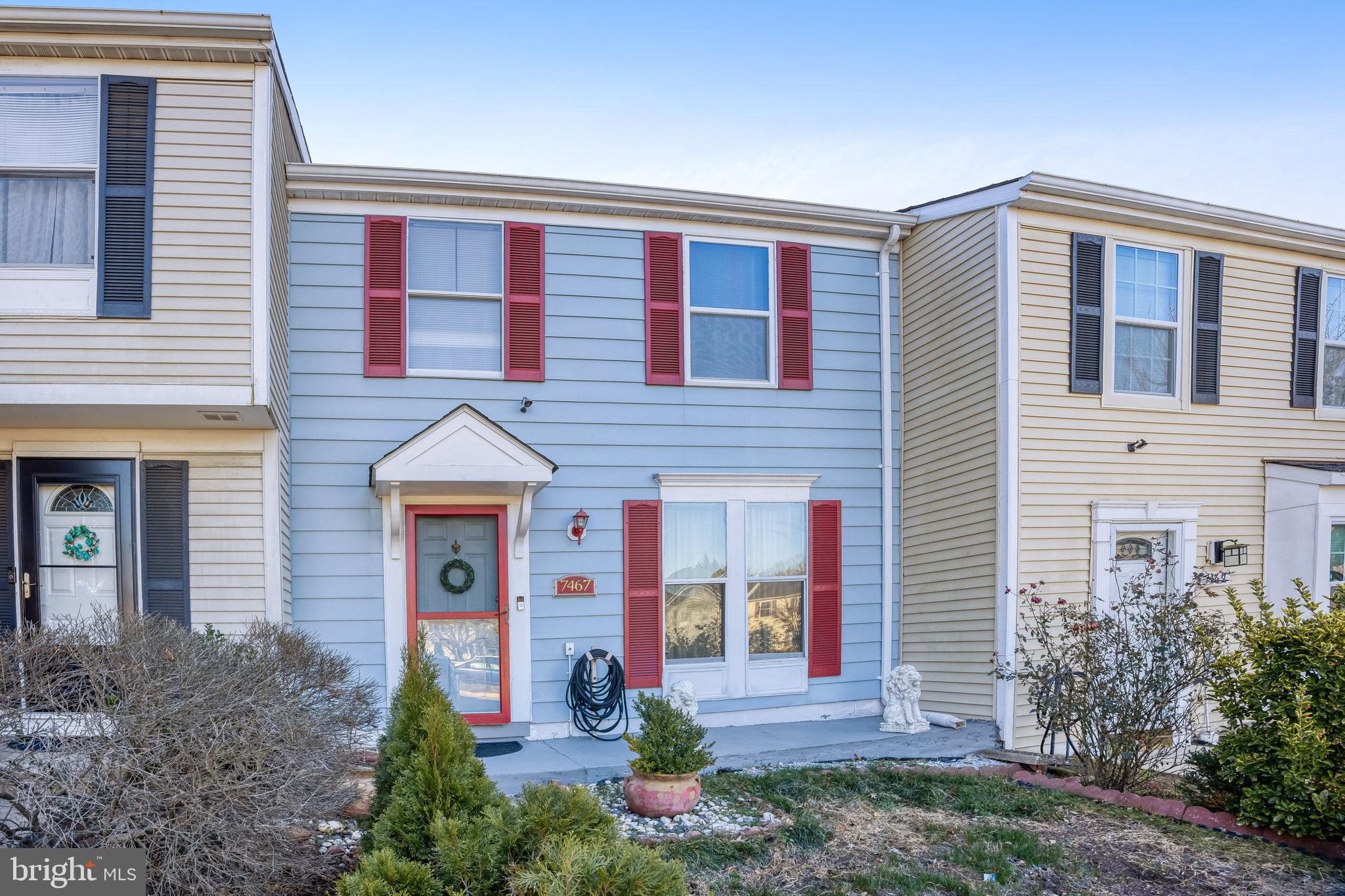 7467 Lone Star Road Lorton, VA 22079 - Photo 18 of 21 a front view of a house with garden