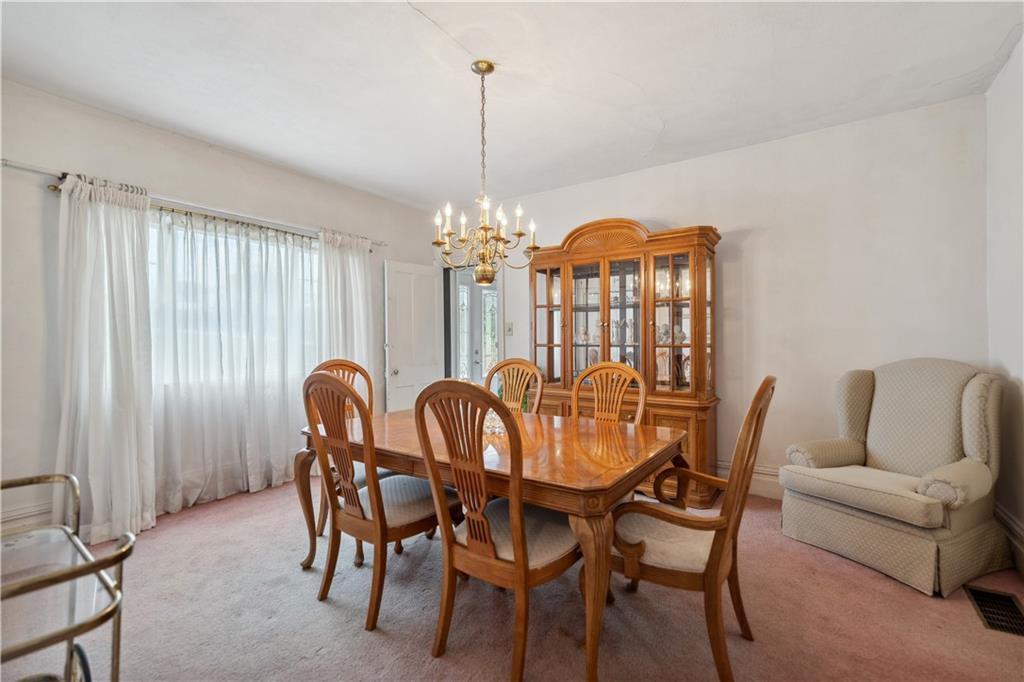 401 Delafayette Street Perryopolis, PA 15473 - Photo 11 of 32 a view of a dining room with furniture and chandelier