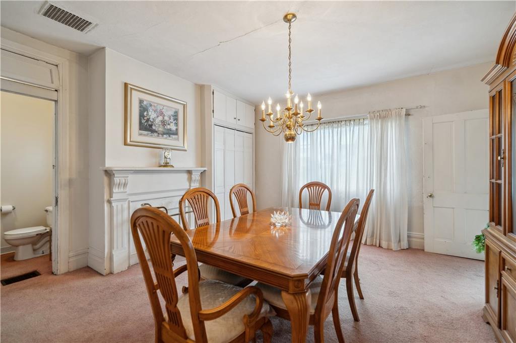 401 Delafayette Street Perryopolis, PA 15473 - Photo 12 of 32 a dining room with furniture and chandelier