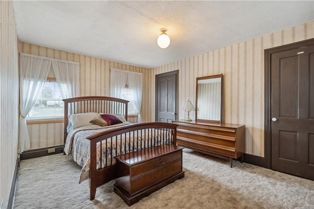 401 Delafayette Street Perryopolis, PA 15473 - Photo 17 of 32 a bedroom with a bed and a window