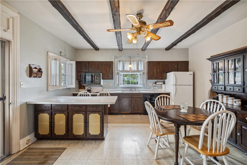 401 Delafayette Street Perryopolis, PA 15473 - Photo 2 of 32 a large kitchen with a table and chairs