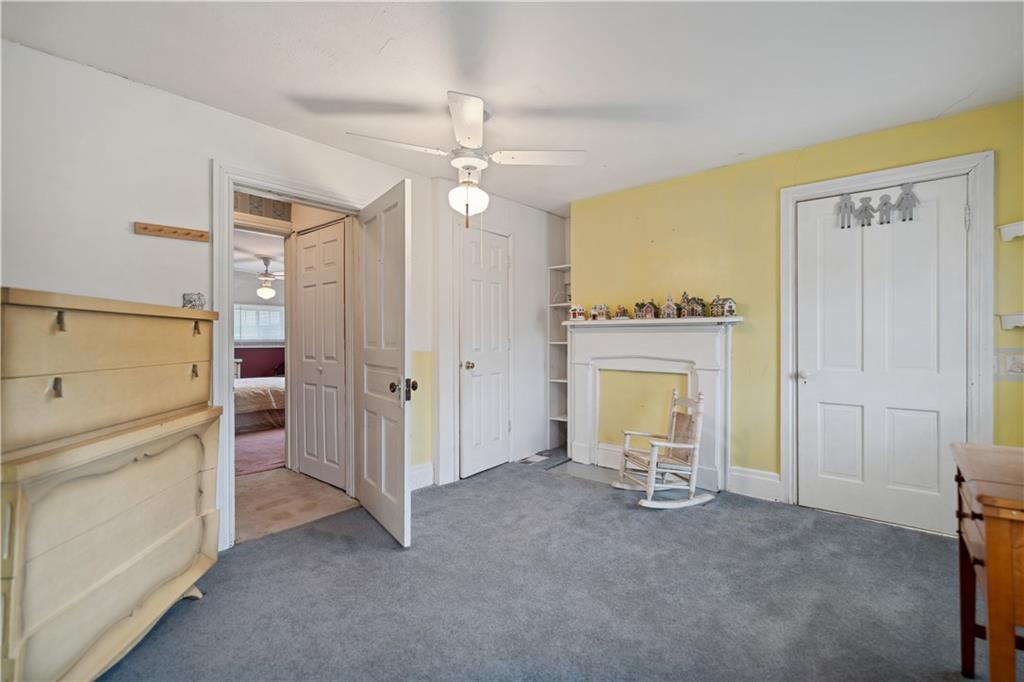 401 Delafayette Street Perryopolis, PA 15473 - Photo 21 of 32 a view of a livingroom with a fireplace a chandelier and closet