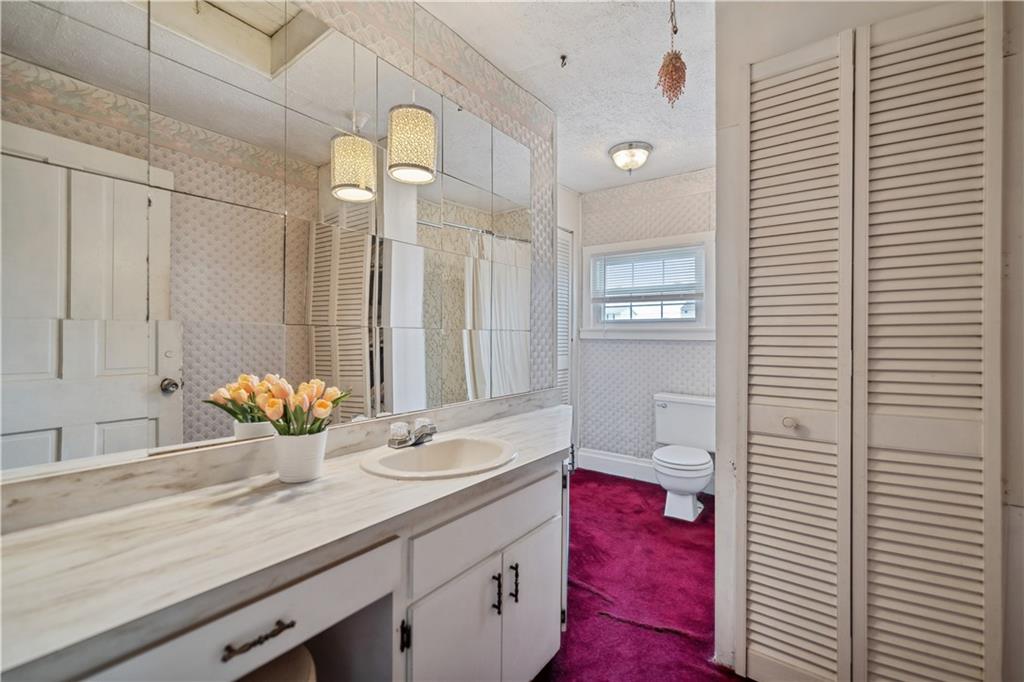 401 Delafayette Street Perryopolis, PA 15473 - Photo 22 of 32 a bathroom with a sink and a mirror