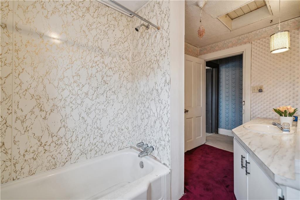 401 Delafayette Street Perryopolis, PA 15473 - Photo 23 of 32 a bathroom with a bathtub and a sink