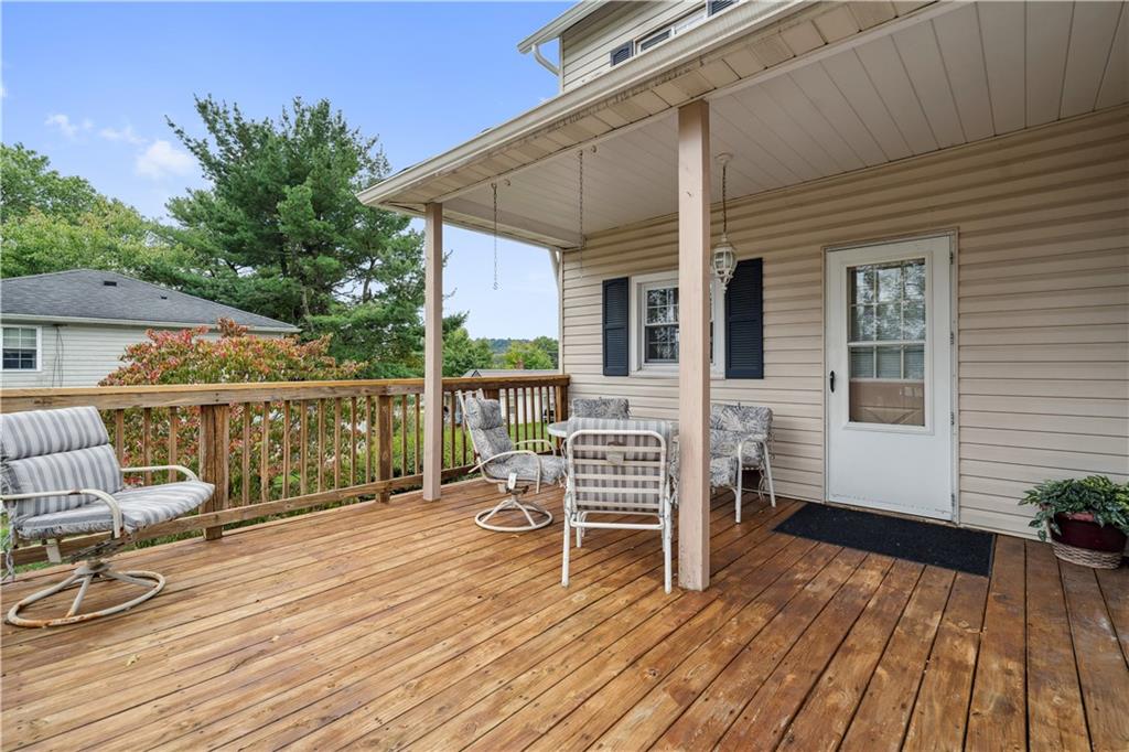 401 Delafayette Street Perryopolis, PA 15473 - Photo 26 of 32 a porch with wooden floor and fence