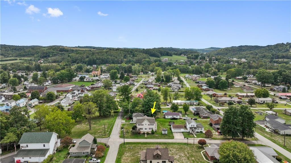 401 Delafayette Street Perryopolis, PA 15473 - Photo 29 of 32 an aerial view of residential houses with outdoor space and trees