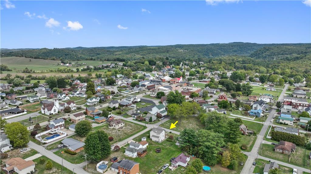 401 Delafayette Street Perryopolis, PA 15473 - Photo 30 of 32 an aerial view of residential houses with outdoor space and trees