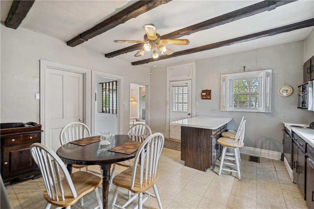 401 Delafayette Street Perryopolis, PA 15473 - Photo 5 of 32 a view of a dining room with furniture and a chandelier
