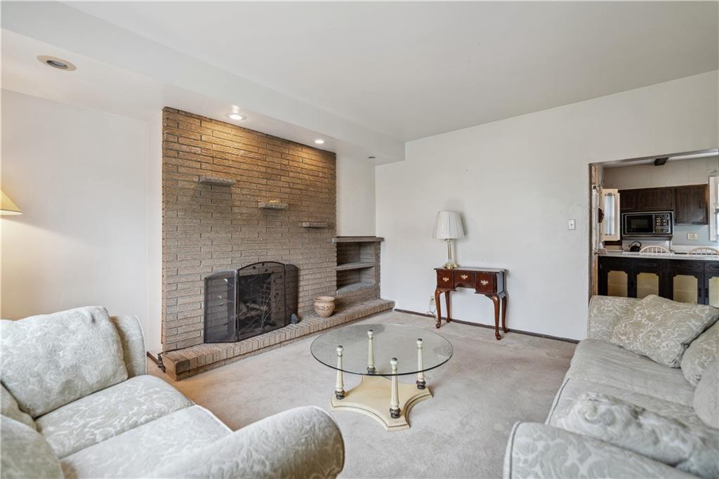 401 Delafayette Street Perryopolis, PA 15473 - Photo 7 of 32 a living room with furniture and a fireplace