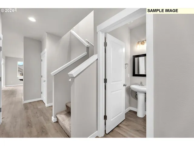 a bathroom with a toilet sink and a mirror