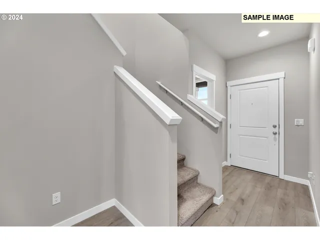 a view of an empty room with stairs