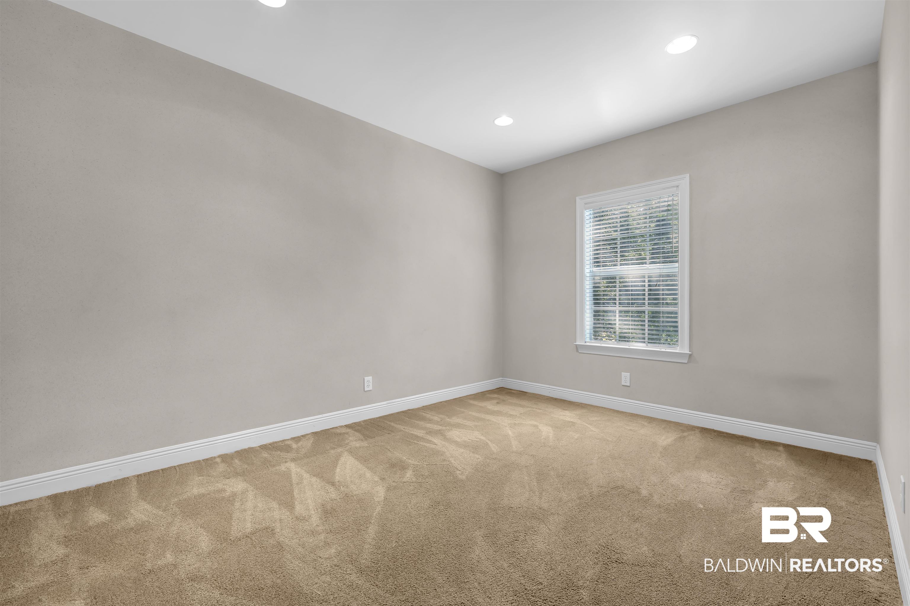 1262 Patrick Street Daphne, AL 36526 - Photo 13 of 35 Empty room with light colored carpet and recessed lighting