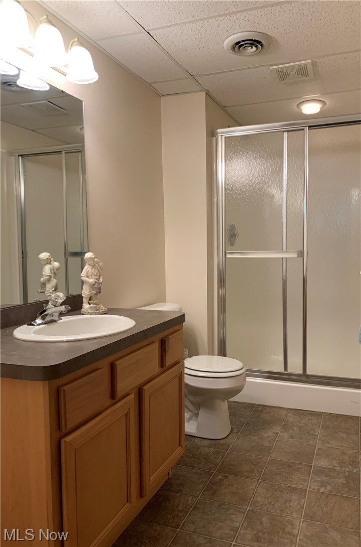14600 Valentine Road Thompson, OH 44086 - Photo 27 of 31 Bathroom with oversized vanity, mirror, a shower with shower door