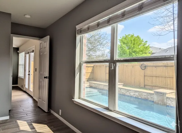 a view of a room that has a large window