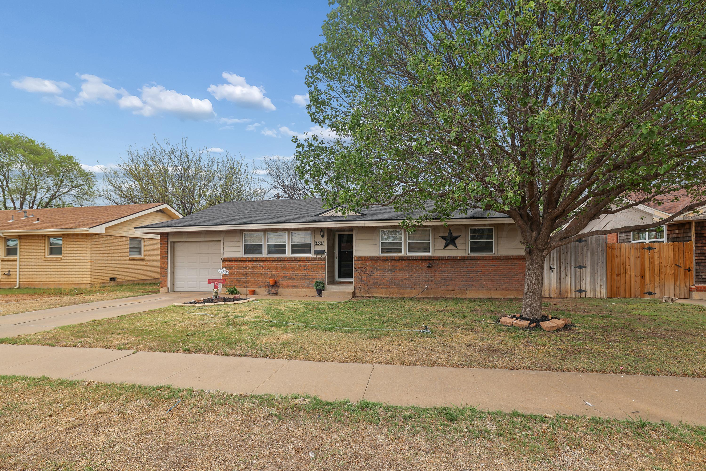 2321 Bell Street Amarillo, TX 79106 - Photo 1 of 24 front view of a house with a big yard
