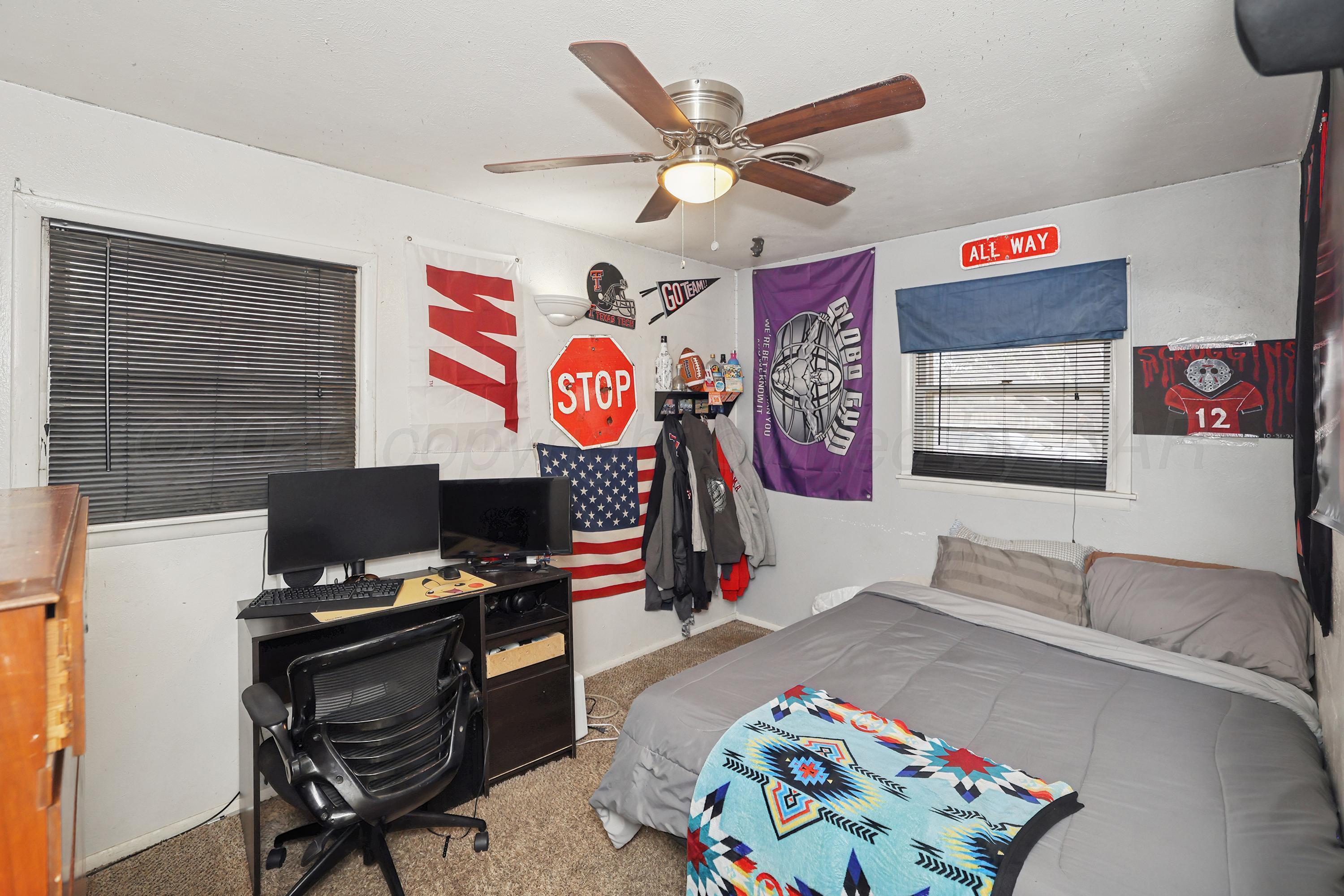 2321 Bell Street Amarillo, TX 79106 - Photo 12 of 24 a bed room with a bed and a desk