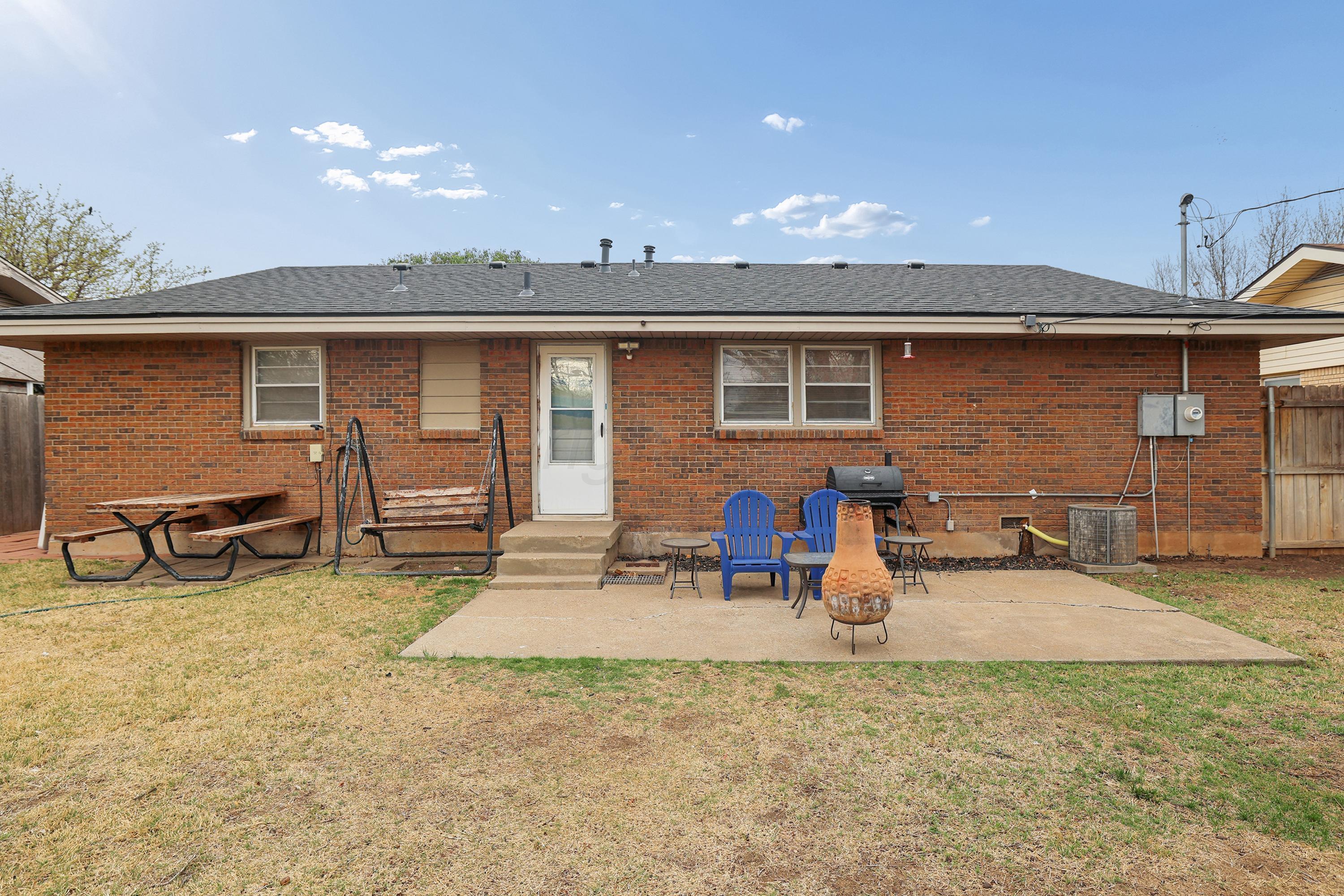 2321 Bell Street Amarillo, TX 79106 - Photo 19 of 24 a view of a backyard with table and chairs