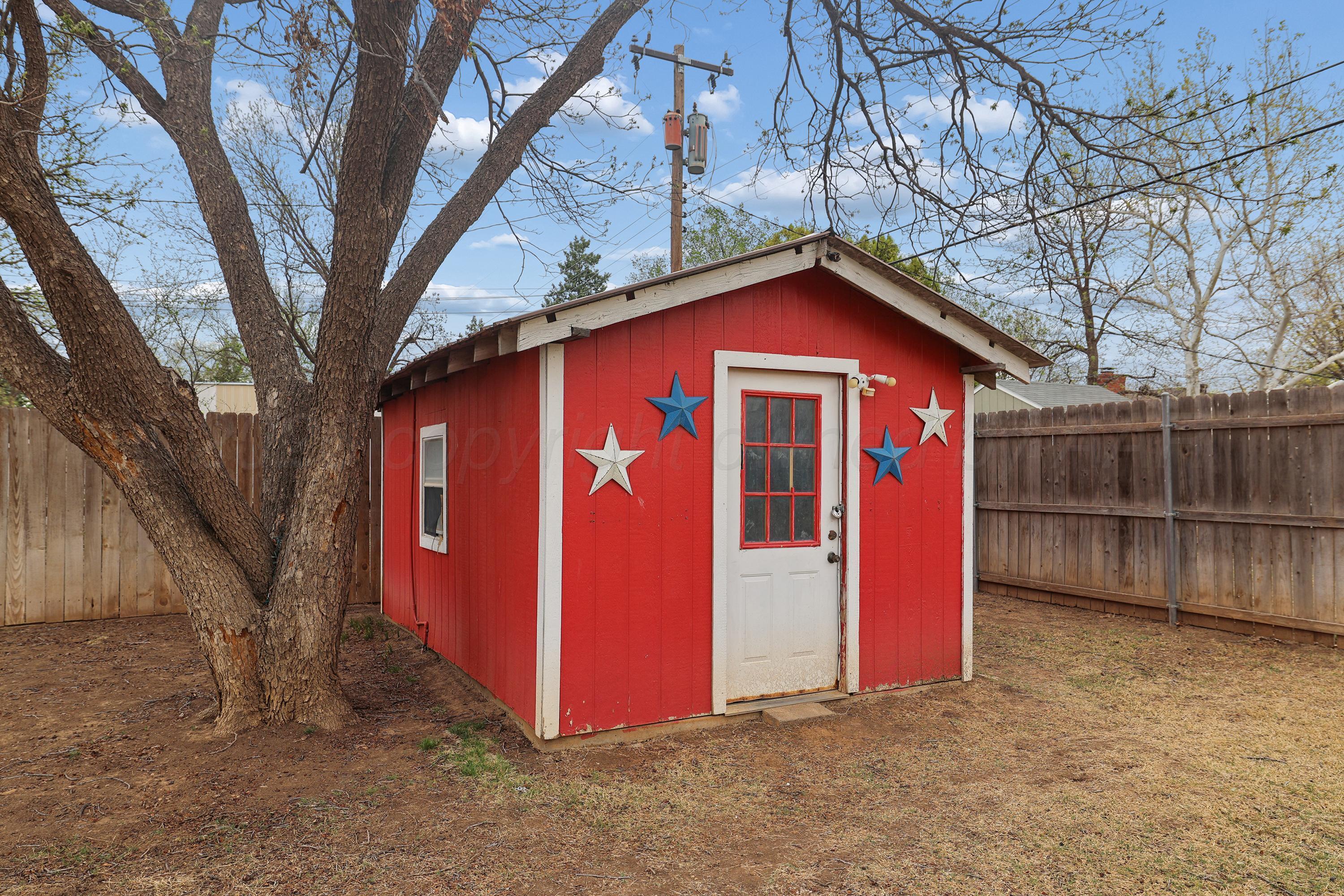 2321 Bell Street Amarillo, TX 79106 - Photo 22 of 24 a front view of a house with a fence