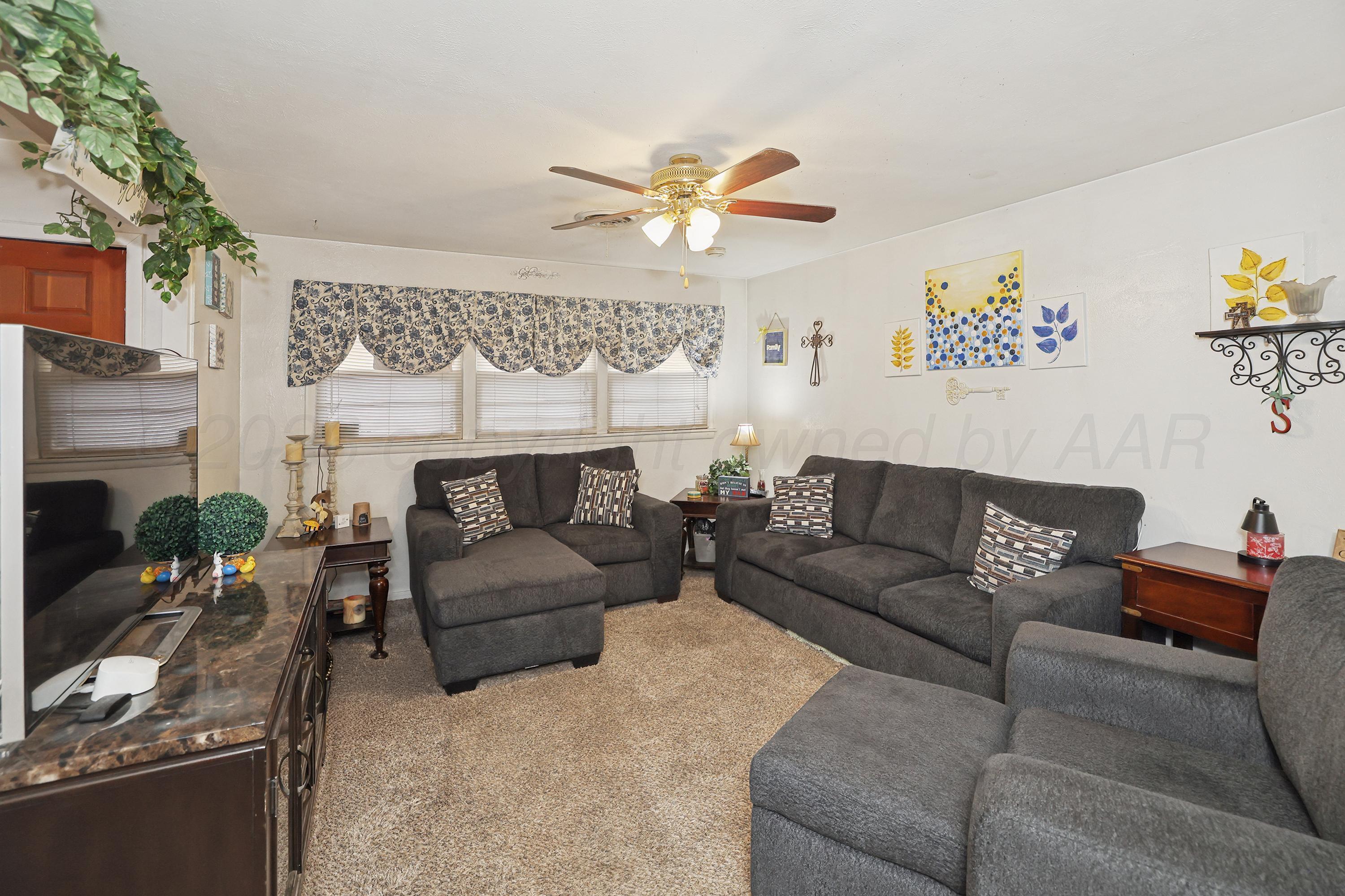 2321 Bell Street Amarillo, TX 79106 - Photo 4 of 24 a living room with furniture and a fireplace
