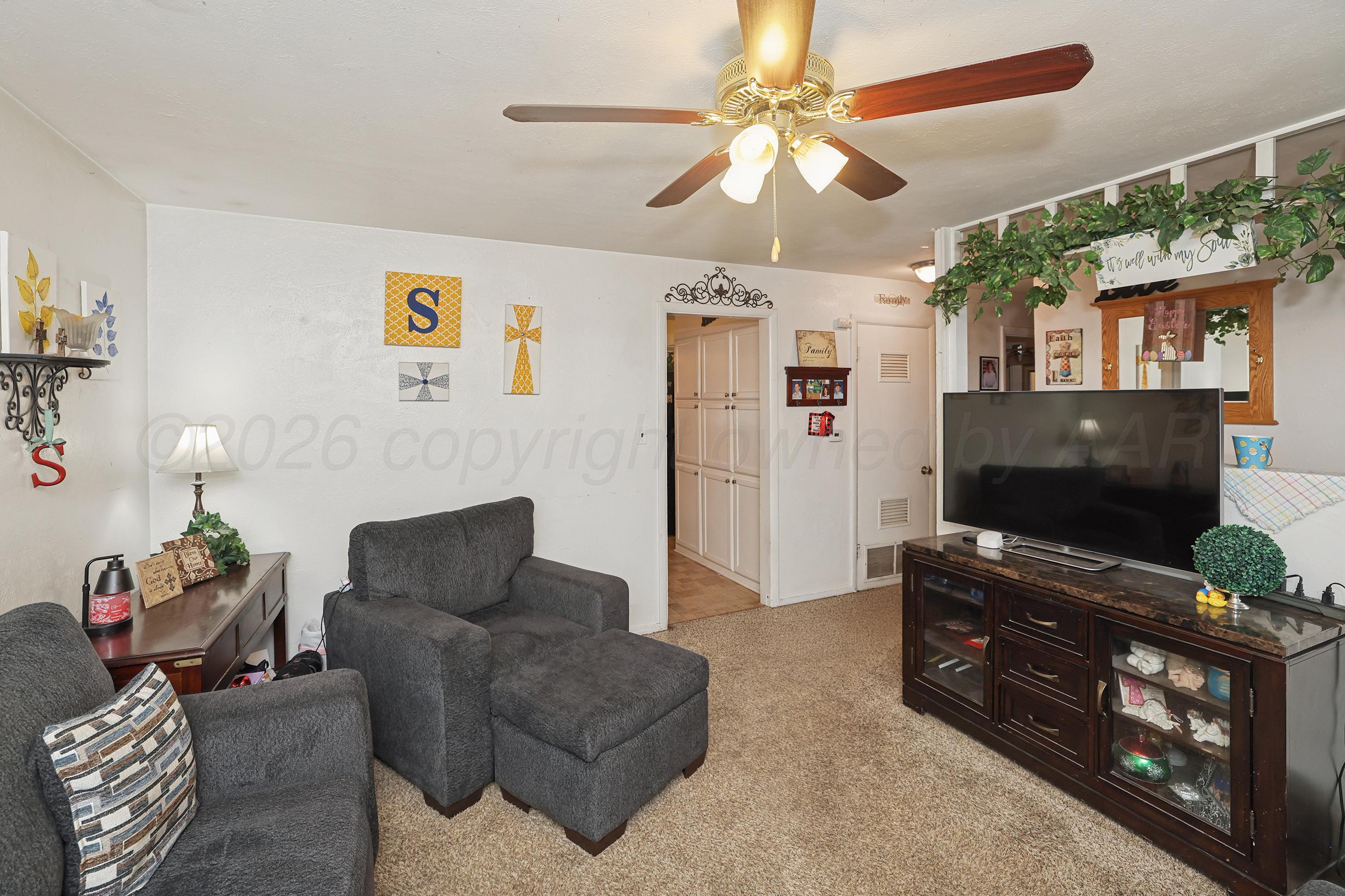 2321 Bell Street Amarillo, TX 79106 - Photo 5 of 24 a living room with furniture and a flat screen tv