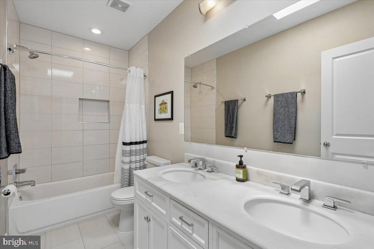 1203 Staples Street Northeast Washington, DC 20002 - Photo 21 of 51 Modern Primary Bathroom with sleek finishes.